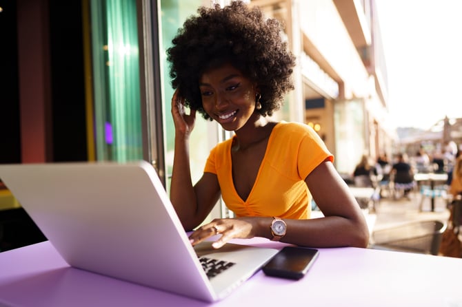 happy-beautiful-young-black-woman-using-laptop-in-2023-11-27-05-04-06-utc