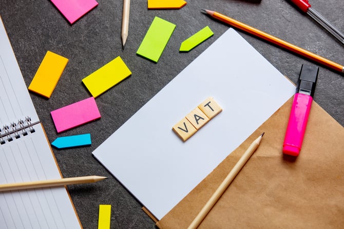 vat-letters-on-paper-sheet-and-notes-around-on-a-t-2024-09-25-06-25-50-utc
