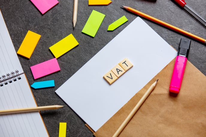 vat-letters-on-paper-sheet-and-notes-around-on-a-t-2024-09-25-06-25-50-utc